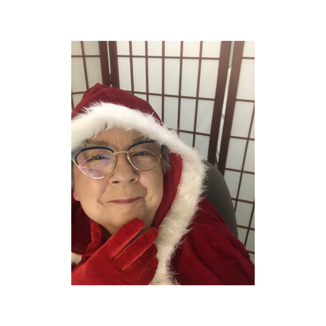 mary-moss-mrs-claus-presentation Mary Moss dressed as Mrs. Claus during a holiday-themed presentation.