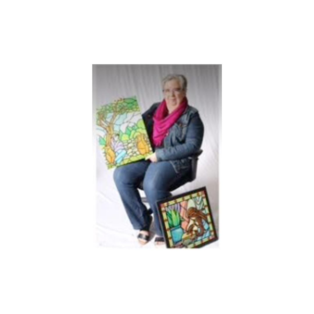 mary-moss-with-original-paintings-commissioned-for-book-cover-artwork Mary Moss seated with original artwork used for two of her book covers.